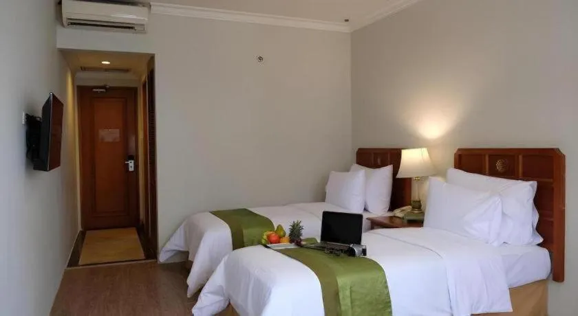 Bed in Grand Cemara Hotel