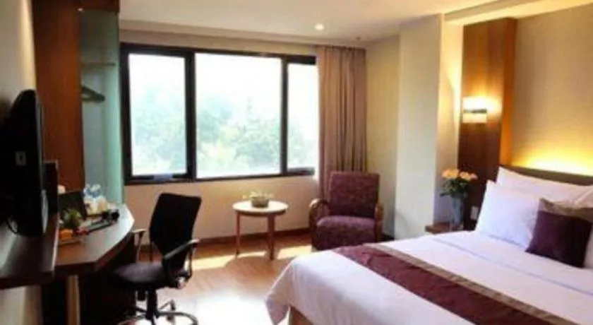 Bed in Grand Cemara Hotel