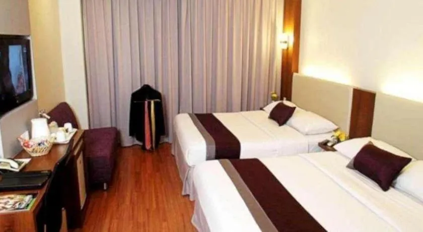 Bed in Grand Cemara Hotel