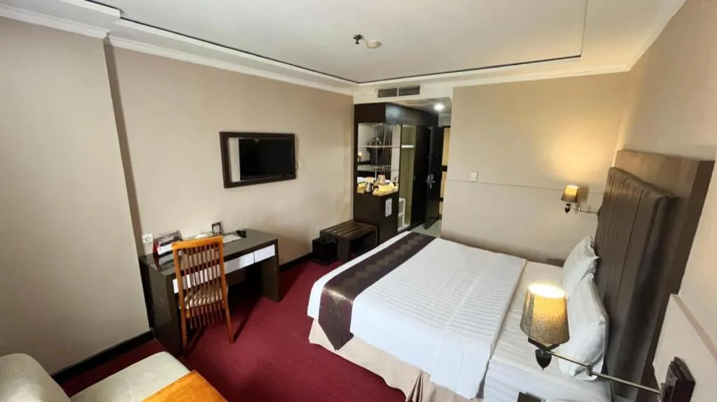 Bed in Grand Antares Hotel