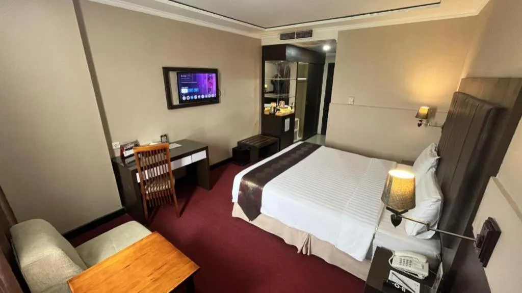 Bed in Grand Antares Hotel