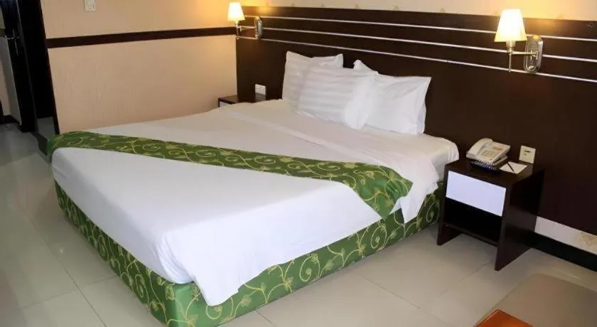 Bed in Grand Antares Hotel