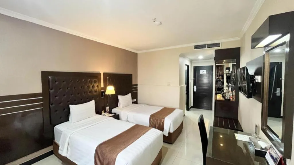 Bed in Grand Antares Hotel