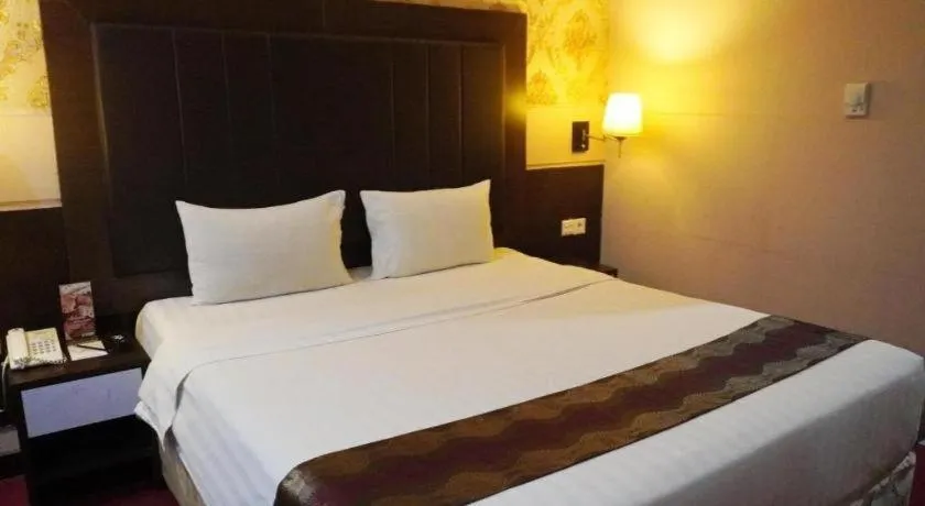 Bed in Grand Antares Hotel