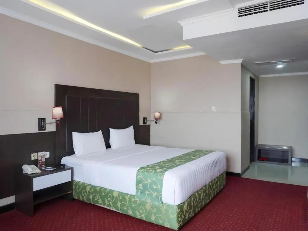 Bed in Grand Antares Hotel