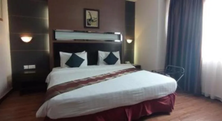 Bed in Grand Antares Hotel