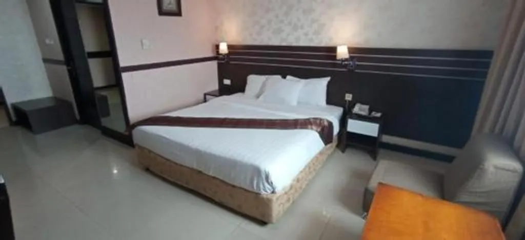 Bed in Grand Antares Hotel