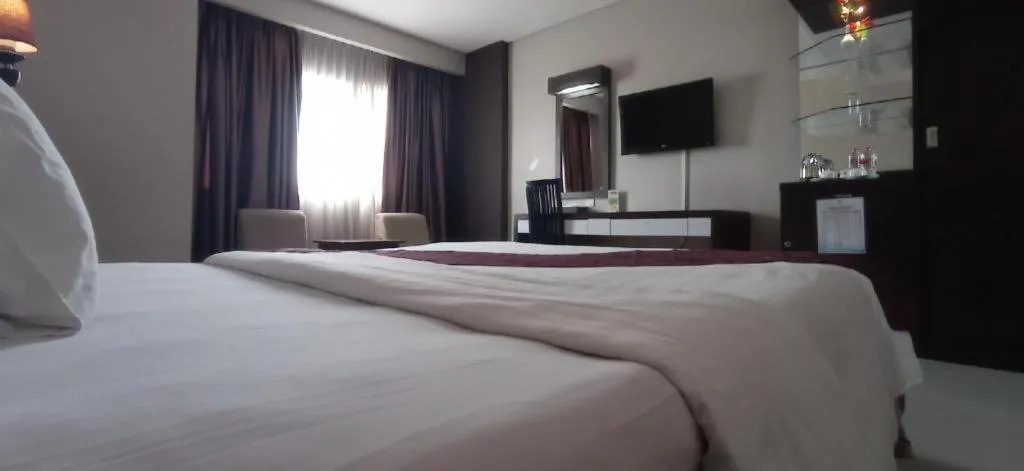 Bed in Grand Antares Hotel