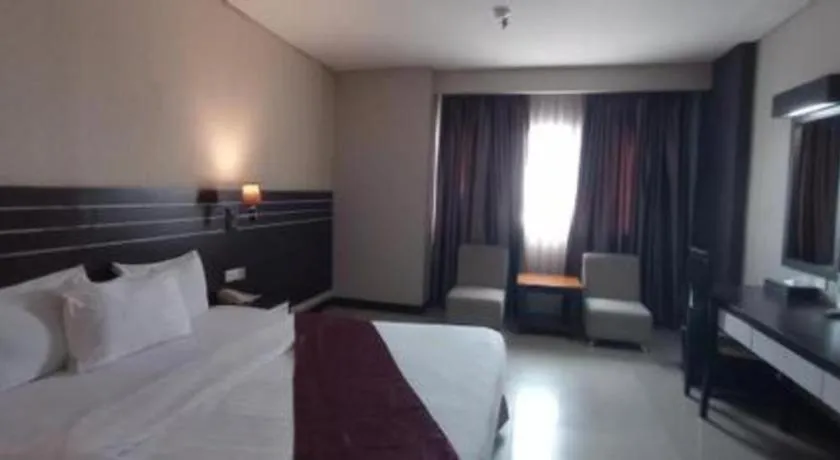 Bed in Grand Antares Hotel