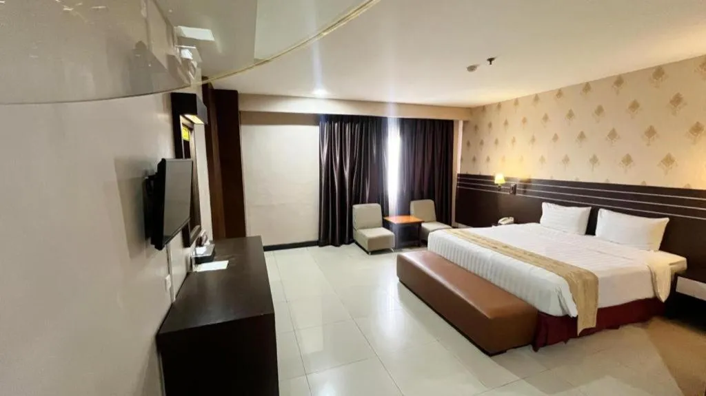 Bed in Grand Antares Hotel