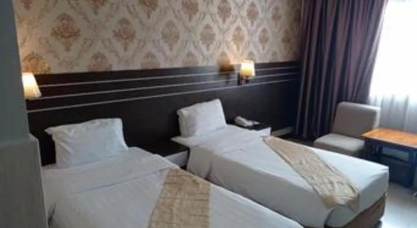 Bed in Grand Antares Hotel