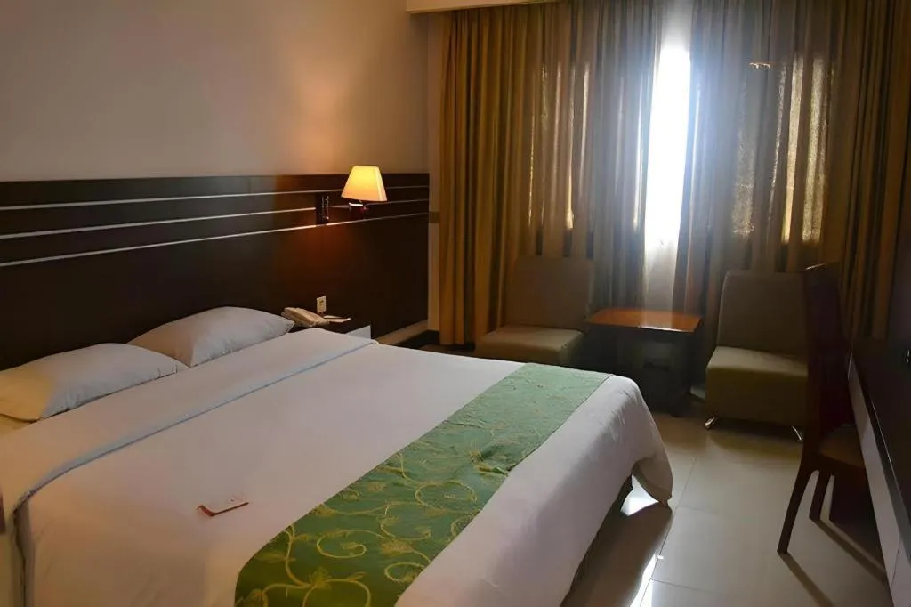 Bed in Grand Antares Hotel