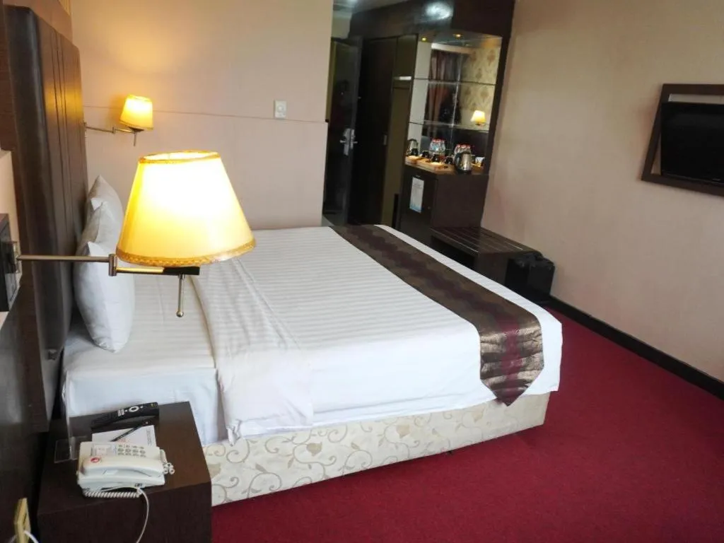 Bed in Grand Antares Hotel