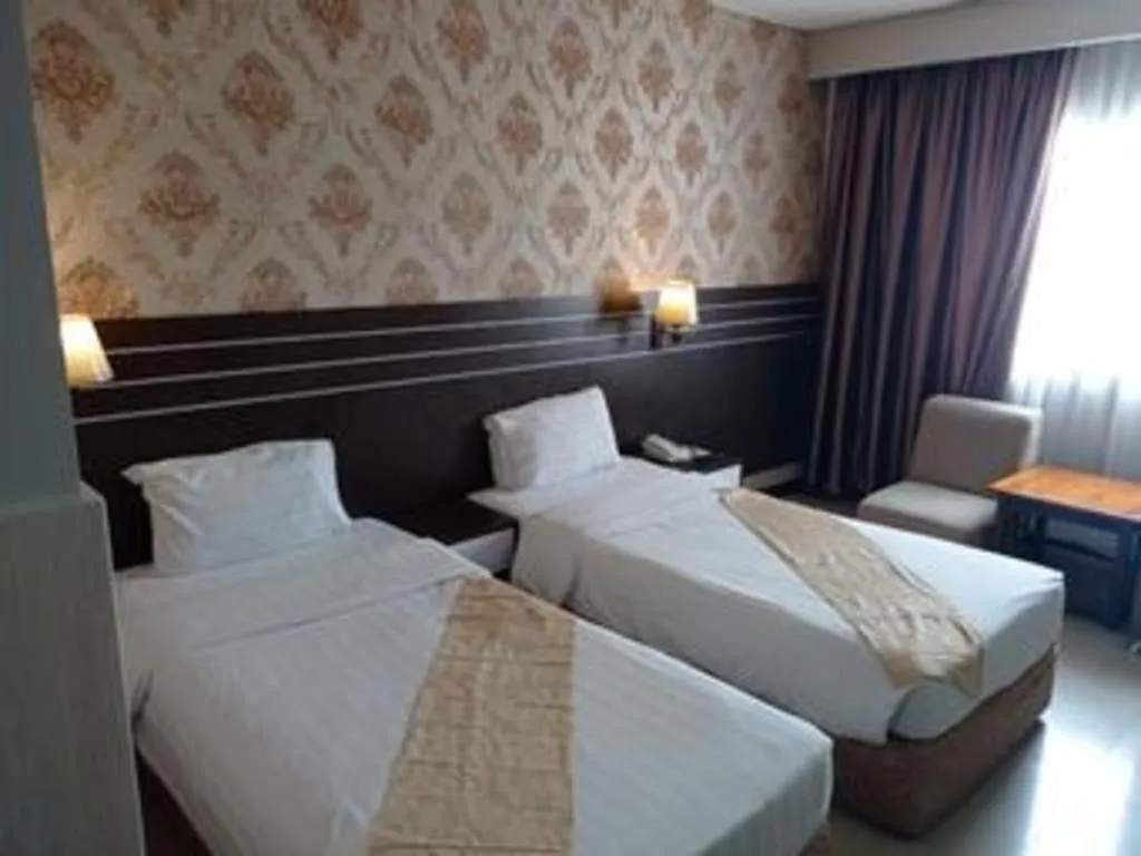Bed in Grand Antares Hotel