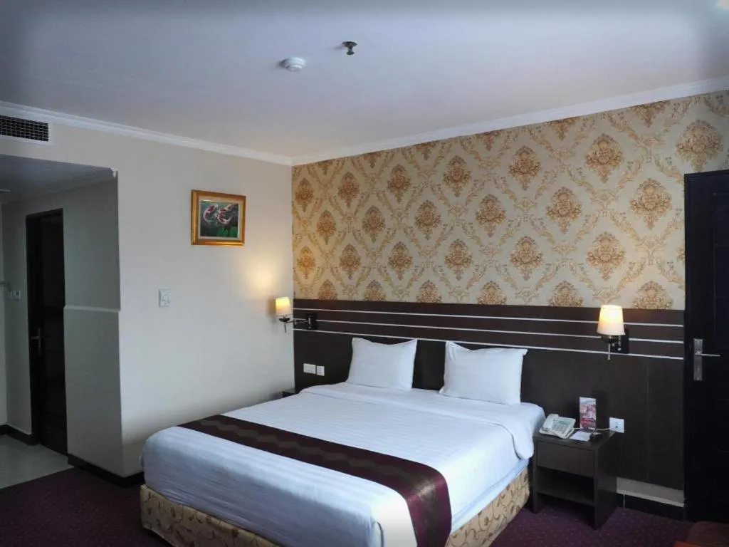 Bed in Grand Antares Hotel