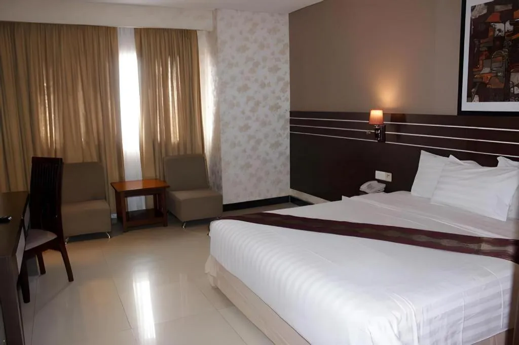 Bed in Grand Antares Hotel