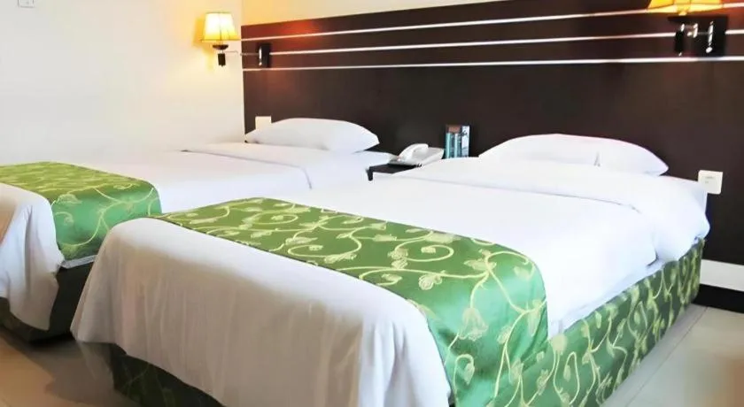 Bed in Grand Antares Hotel