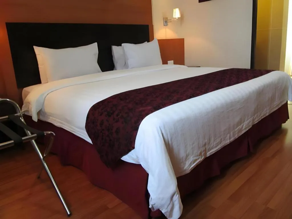 Bed in Grand Antares Hotel