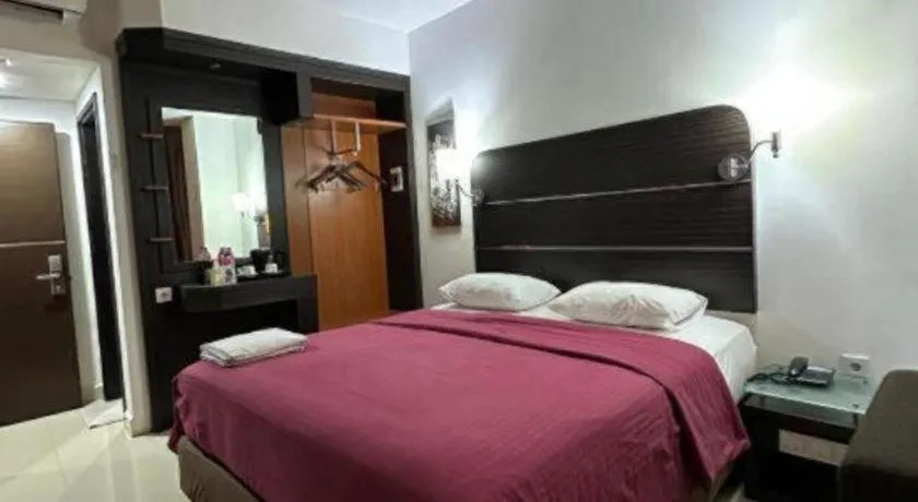 Bed in Travello Hotel Manado