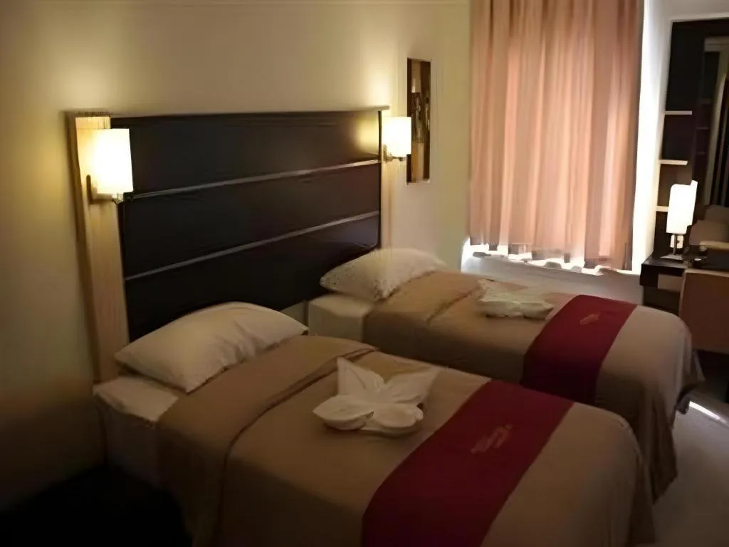 Bed in Travello Hotel Manado