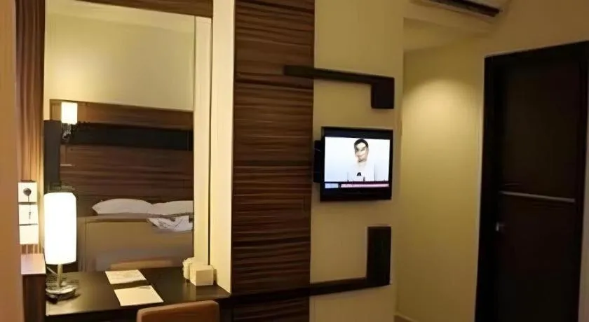 Bed in Travello Hotel Manado