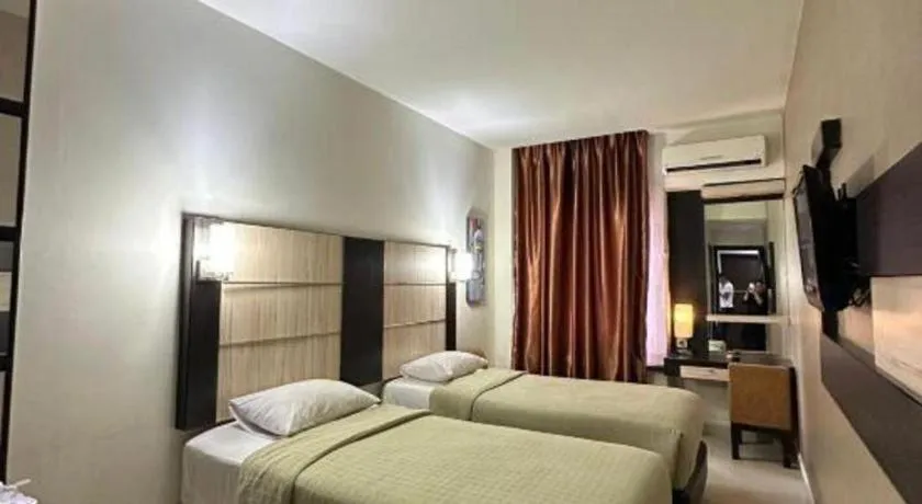 Bed in Travello Hotel Manado