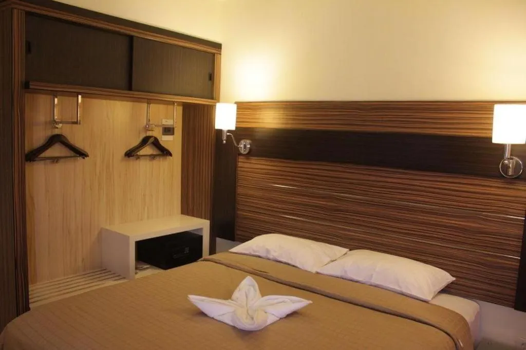 Bed in Travello Hotel Manado