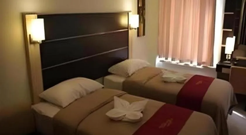 Bed in Travello Hotel Manado