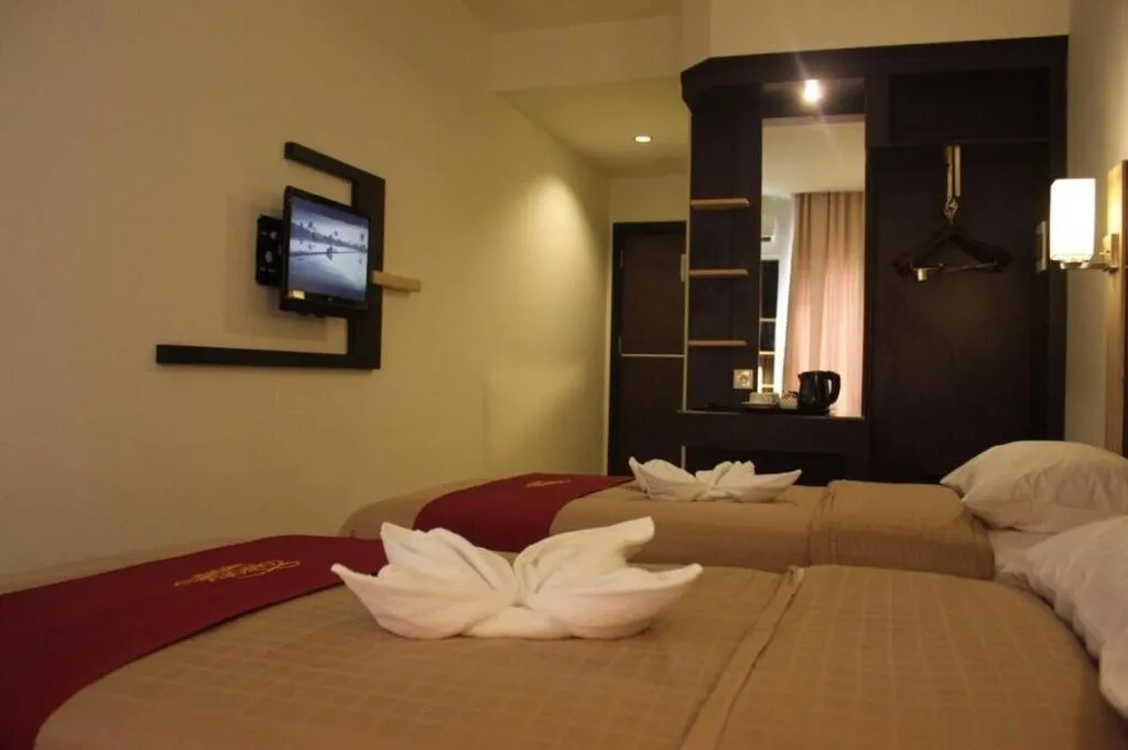 Bed in Travello Hotel Manado