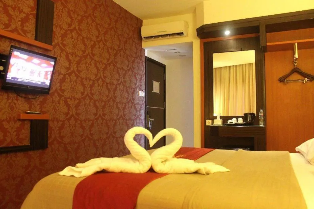 Bed in Travello Hotel Manado
