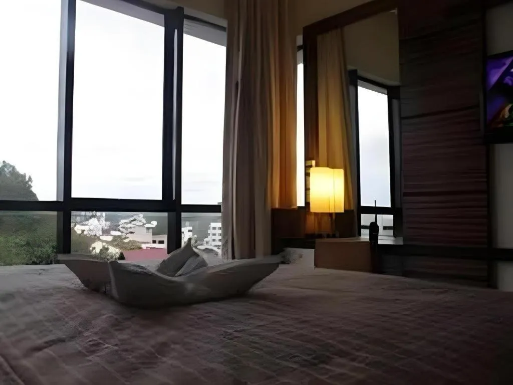 Bed in Travello Hotel Manado