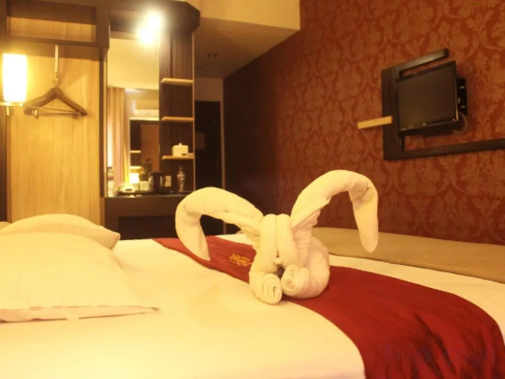 Bed in Travello Hotel Manado