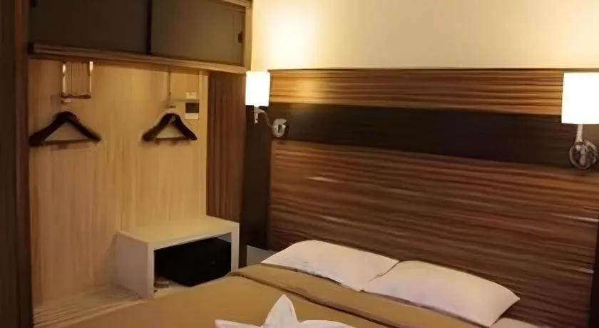 Bed in Travello Hotel Manado