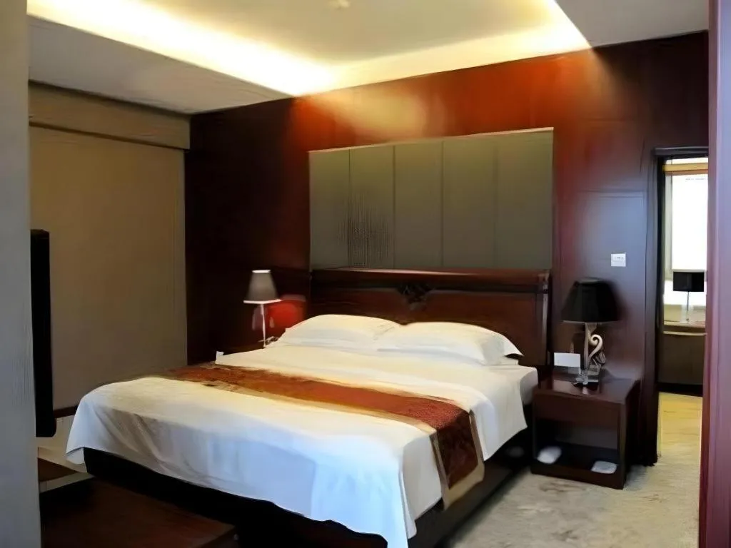 Bed in Fujian Galaxy Garden Hotel