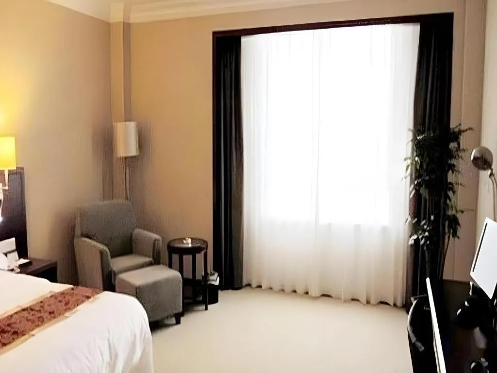 Bed in Fujian Galaxy Garden Hotel