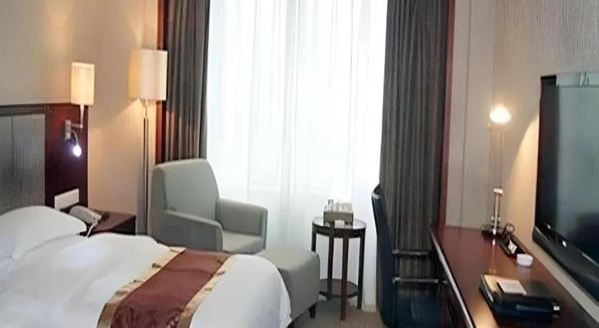 Bed in Fujian Galaxy Garden Hotel