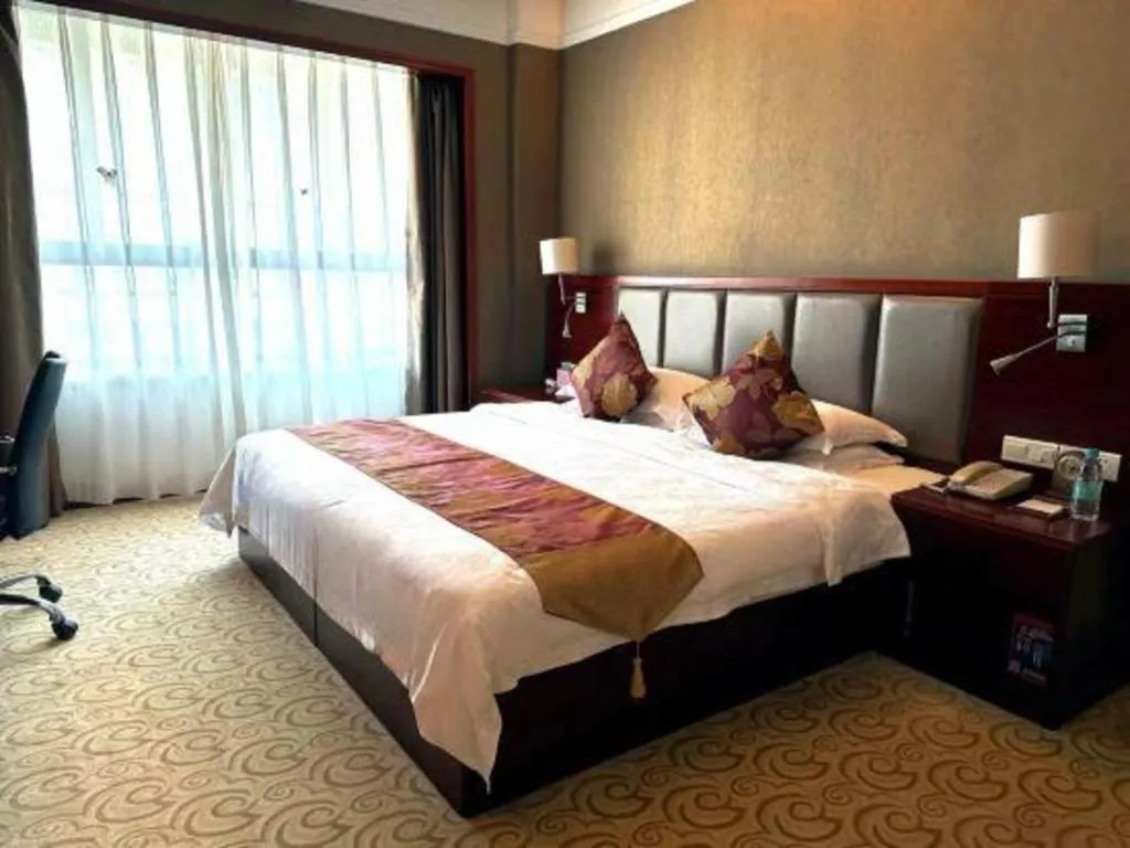 Bed in Fujian Galaxy Garden Hotel