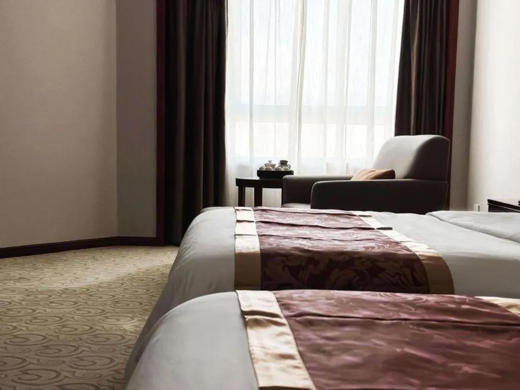 Bed in Fujian Galaxy Garden Hotel