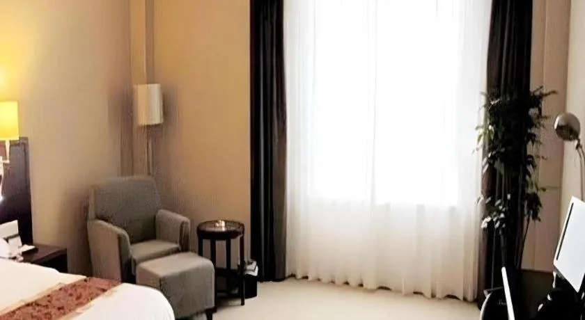 Bed in Fujian Galaxy Garden Hotel