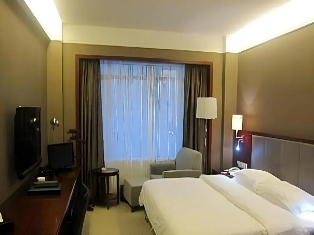 Bed in Fujian Galaxy Garden Hotel