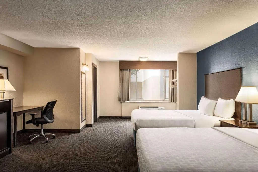 Bed in AmericInn by Wyndham La Crosse Riverfront-Conference Center