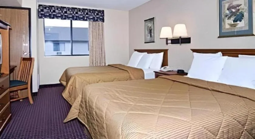 Bed in AmericInn by Wyndham La Crosse Riverfront-Conference Center