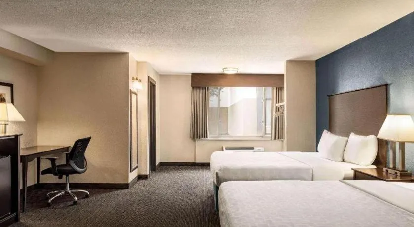 Bed in AmericInn by Wyndham La Crosse Riverfront-Conference Center