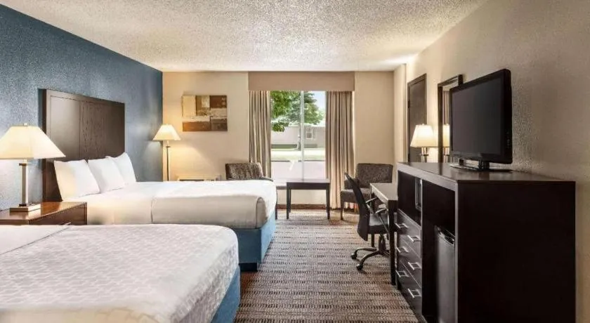 Bed in AmericInn by Wyndham La Crosse Riverfront-Conference Center