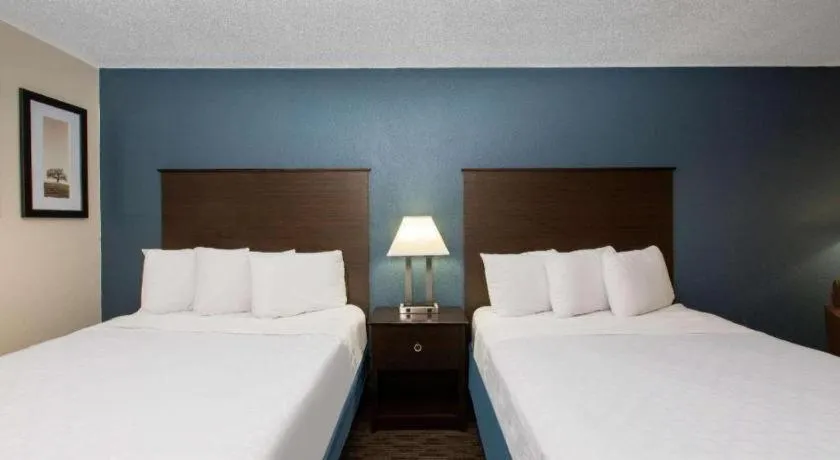 Bed in AmericInn by Wyndham La Crosse Riverfront-Conference Center