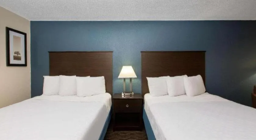 Bed in AmericInn by Wyndham La Crosse Riverfront-Conference Center