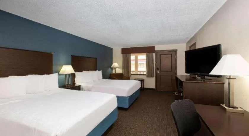 Bed in AmericInn by Wyndham La Crosse Riverfront-Conference Center