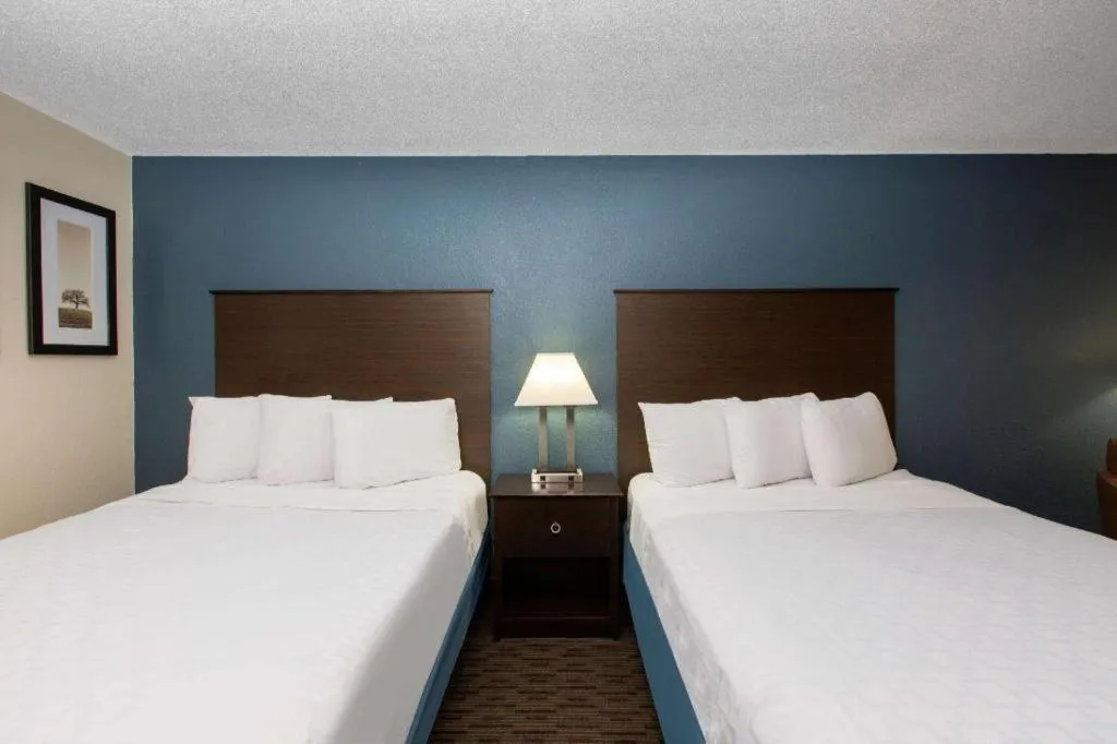 Bed in AmericInn by Wyndham La Crosse Riverfront-Conference Center