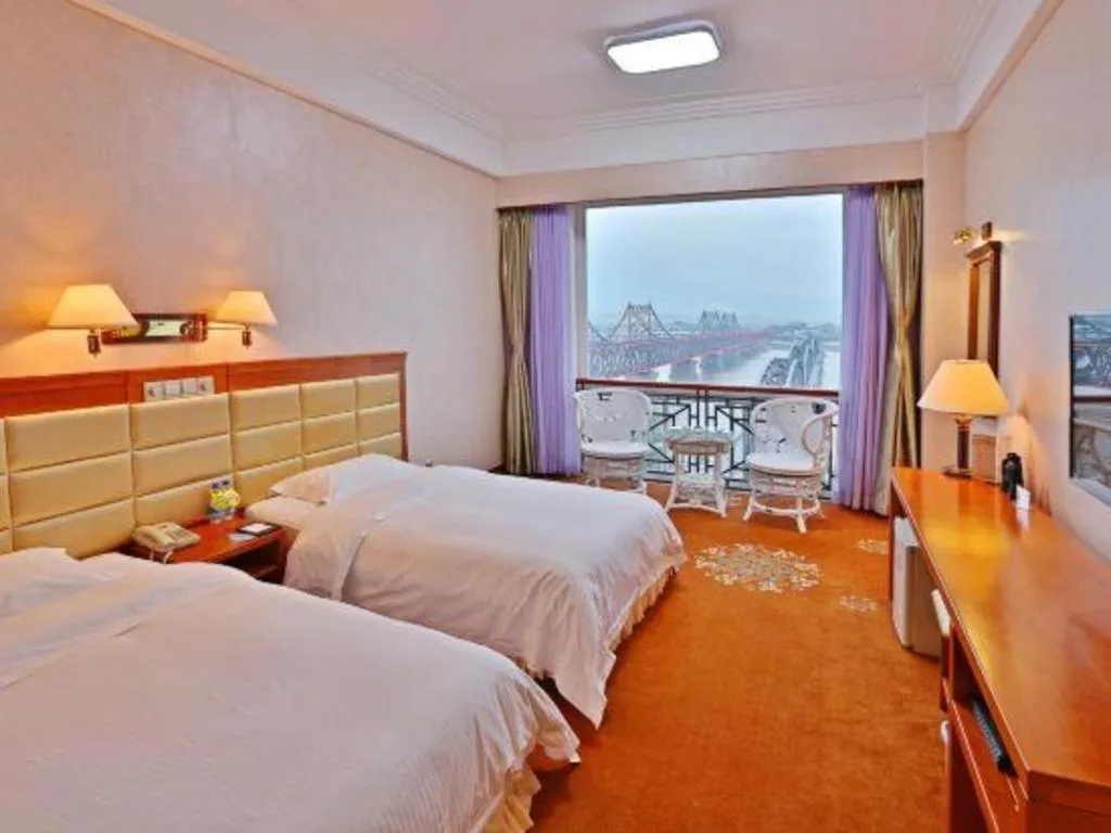 Bed in Dandong Rising Zhonglian Hotel