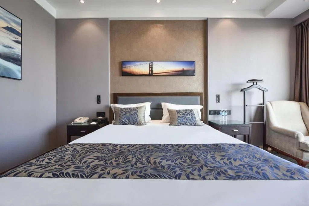 Bed in Dandong Rising Zhonglian Hotel